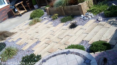 Rustic driftwood beach effect small garden with water feature