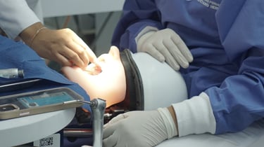 a woman in a surgical mask and a nurse in a surgical gown