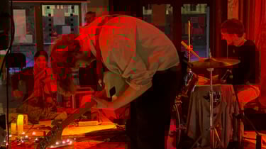 A picture of artists playing their instruments