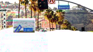 Vista panorâmica de Los Angeles, com destaque para o centro urbano ao entardecer, cenário de partida ou escala em cruzeiros