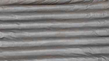 close up photo of grey porous geotextile used in UK manufacture of pro earth environment protection products