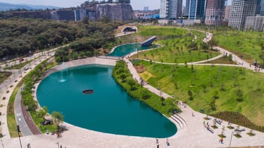 a large pond with a fountain and a fountain