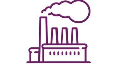 a factory with a factory with a large amount of smoke coming out of it