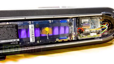 a close up of a computer case with a battery