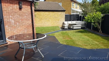 Corner Triangle Garden With Black & Grey Limestone Patio Sleeper Retaning Walls Multi-tier Level