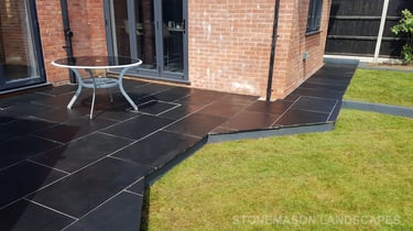 Corner Triangle Garden With Black & Grey Limestone Patio Sleeper Retaning Walls Multi-tier Level