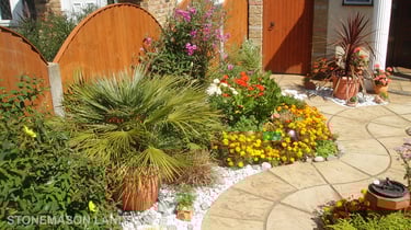 Curvey winding path, circle kits paving slabs weaving through lots of beautiful plants & flowers
