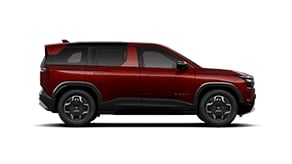 Side profile of red Tata SUV Pure variant featuring alloy wheels and a bold, modern exterior.