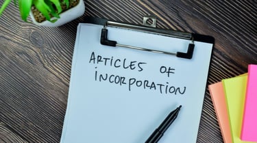 a clipboard with a note pad attached to it