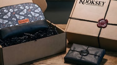 Kooksey product packaging. Black tissue paper, twine, wax seal, Kraft tag, boxes and custom sticker