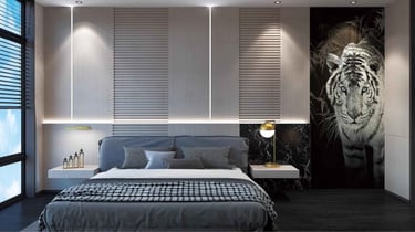 a bedroom with a bed and a painting on the wall