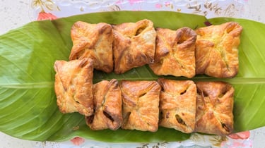 Veg puff filled with spiced vegetables, served fresh at Aroha Dosas