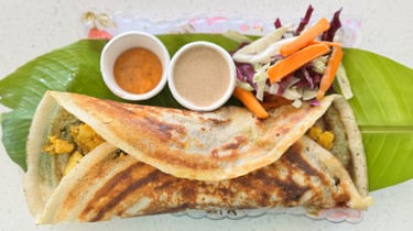 Masala dosa filled with spiced potato, served fresh at Aroha Dosas