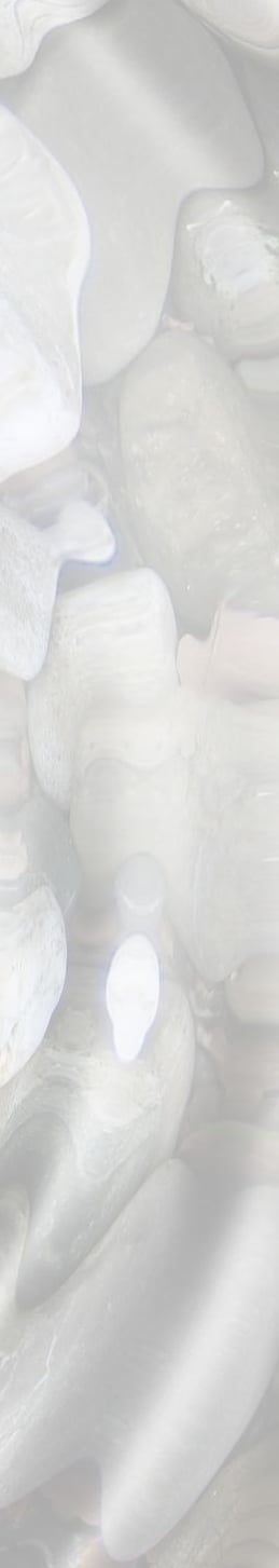 Gentle water ripples over pastel coloured pebbles creating a calm soothing scene - Braver Days