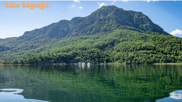 a mountain scene with a lake and a boat