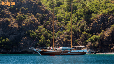 a boat with a sailboat in the water