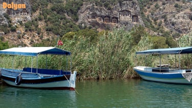 two boats are parked in the water
