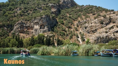a boat on the water with a mountain in the background