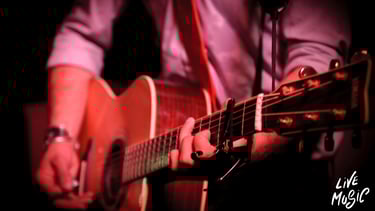 a man playing a guitar