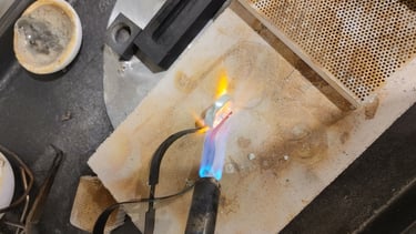 Pure silver being soldered and hand-formed into shape.