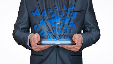 a man in a suit and tie is holding a tablet with a tablet