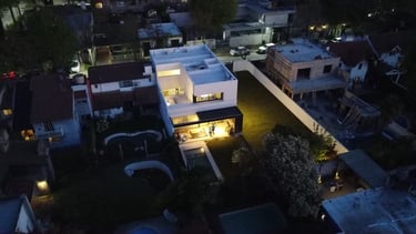 a house with a pool and a pool in the middle of the night