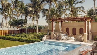 One&Only The Palm villa featuring a private pool, lush garden, and serene outdoor lounge and gazebo.