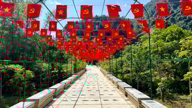 a bridge with flags and flags hanging from the side