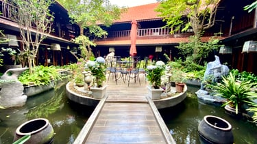 a wooden walkway leading to a wooden deck