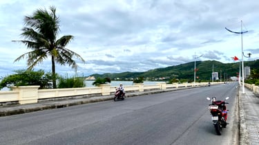 a motorcycle  parked on the side of a road