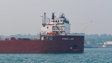 Close-up of the forward pilothouse of huge red freighter Stewart J. Cort.