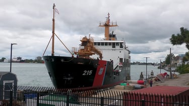 Black and white U.S. Coast Guard cutter docking in Port Huron.