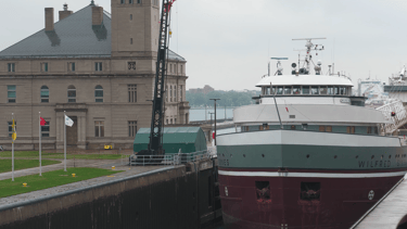 Classic forward pilothouse freighter Wilfred Sykes eases into the MacArthur Lock.