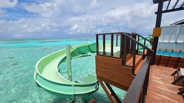 Ozen Life Madhoo Maldives overwatrer villa slide