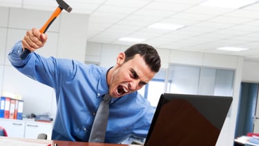 Frustrated man at computer