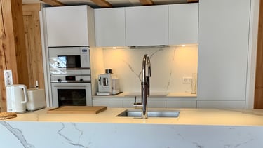 a kitchen with a marbled counter top