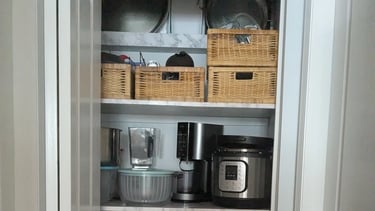 Organized kitchenware closet with strong shelving