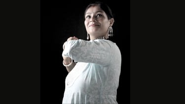 A woman demonstrating a kathak dance pose. She is Ms. Rachita, Founder of Thirkan Lalit Kkala Kendra
