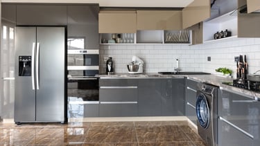 a kitchen with a refrigerator and a refrigerator freezer