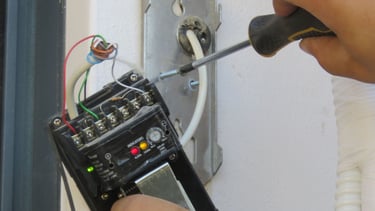 a person is using a screwdriver to fix a broken phone