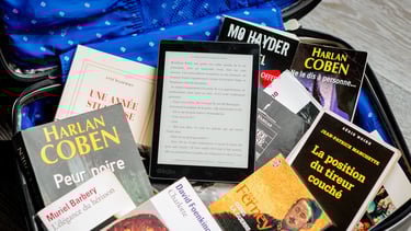 a suitcase with books and bookshelves in it