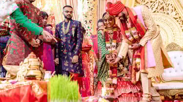 Indian Groom and Bride are offerings to holy fire
