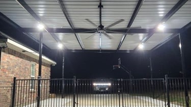 Black Fence with Fan Above