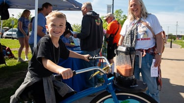 Young boy on our blender bike powering a smoothie!