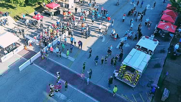 An overhead drone shot of the Start/Finish line and vendor expo at the Chick Fil A 10K in Athens, AL