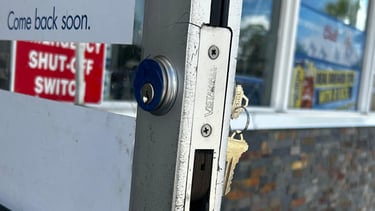 Commercial locksmith repairing office door lock in North Florida