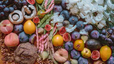 a bunch of colorful fruits and vegetables on a table