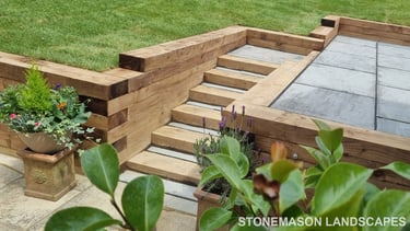 Sleeper Retaining Walls, Planters & Steps With Grey Sandstone Patio & Lawn