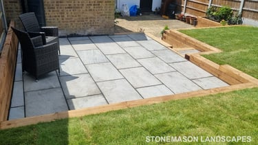 Sleeper Retaining Walls, Planters & Steps With Grey Sandstone Patio & Lawn