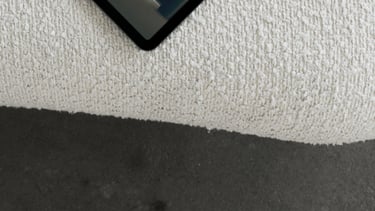 a tablet with a book on it and a book on the floor